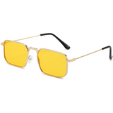 Yellow sunglasses with gold frames on a white background